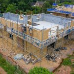 Construction workers building house